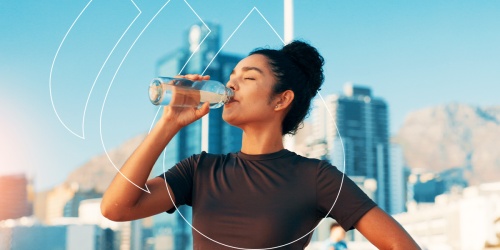 Woman drinking water from a bottle with a city skyline and geometric graphics in the background.
